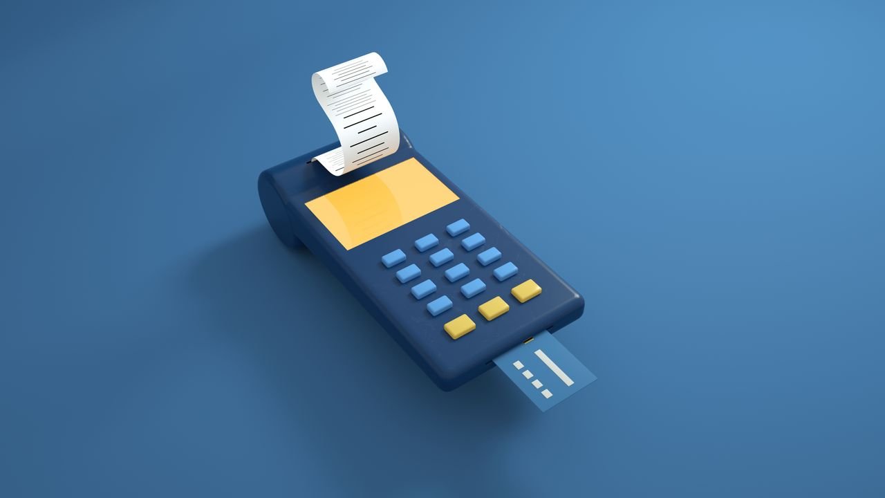 Home A blue card reader with a receipt printout and inserted card on a blue background.